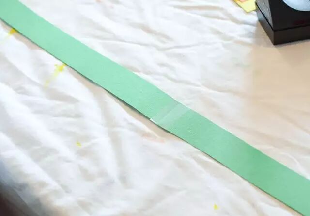 Cut green cardboard strips