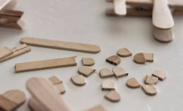 Cut off the round heads on both sides of the popsicle stick.