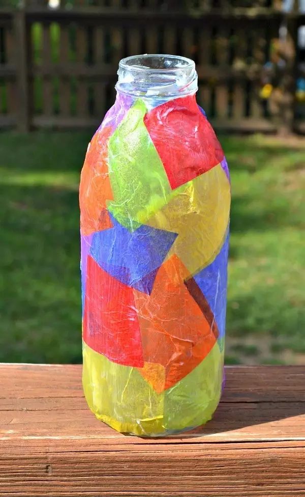 Cut the stickers into small pieces and stick them on the bottle