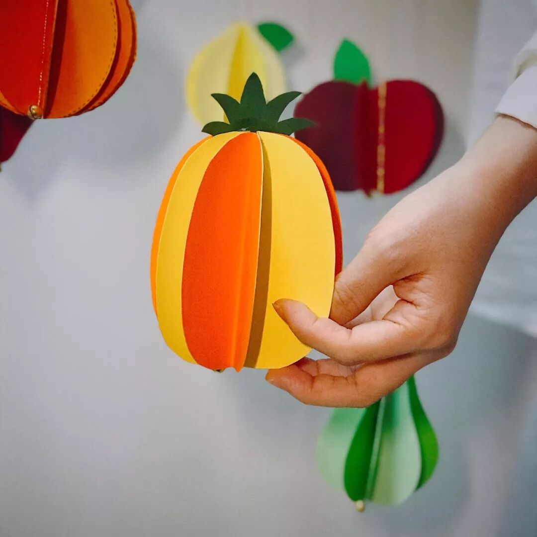 Display of handmade pineapple wind chimes