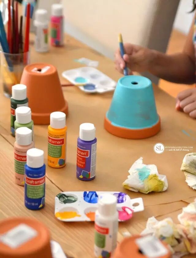 paint the flower pots with nice colors and patterns